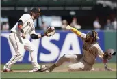  ?? JEFF CHIU — THE ASSOCIATED PRESS ?? The San Diego Padres’ Fernando Tatis Jr., right, steals second base next to San Francisco Giants shortstop Brandon Crawford during the sixth inning in San Francisco on Saturday.
