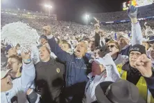  ?? APPHOTO ?? FEEL-GOOD STORY: Penn State coach James Franklin (center) celebrates Saturday’s upset of Ohio State.