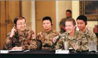  ?? YIN HANG / FOR CHINA DAILY ?? Major General Li Hui (left) of the Political Work Department of the Central Military Commission talks with US Army Major General Susan Davidson at a seminar, part of a joint humanitari­an and disaster relief exercise in Portland, Oregon, on Monday.
