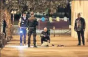  ?? AFP ?? French police at the scene of the knife attacks.