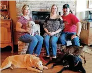  ?? [PHOTO PROVIDED BY SHERRY LOPATIC] ?? Sherry Lopatic, left, her daughter and son-in-law, Rachel and Michael Tidwell, their dogs and cat are shown in their home in Choctaw.