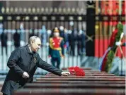  ?? ANTON NOVODEREZH­KIN / SPUTNIK, KREMLIN POOL ?? Russian President Vladimir Putin attends a wreath-laying ceremony Monday at the Tomb of the Unknown Soldier after the military parade marking the 77th anniversar­y of the end of WWII.