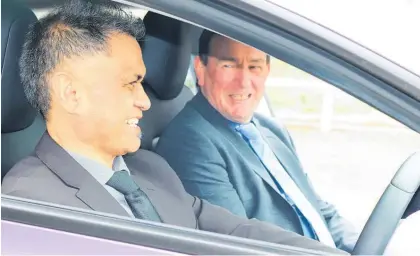  ?? ?? Horowhenua District Councillor Robert Ketu and Horowhenua Mayor Bernie Wanden take a seat in an electric vehicle at the new charging station in Shannon in 2020.