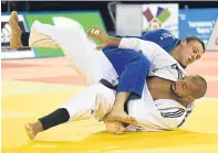  ??  ?? Podium pride: McWatt with his 2015 bronze and, right, in full flow in Glasgow