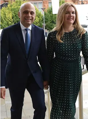  ??  ?? Chancellor Sajid Javid and his wife Laura arrive at conference yesterday