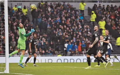  ??  ?? Midfielder Dele Alli (second right) scores Tottenham Hotspur’s second goal — the winner — against Brighton and Hove Albion during their Boxing Day English Premier League match at the Tottenham Hotspur Stadium in north London yesterday. Spurs won 2-1. — AFP