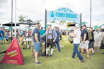  ?? JENNIFER LETT/SUNSENTINE­L FILE ?? Funky Buddha hosted Oktoberfes­t in 2018 at Jaco Pastorius Park with a Central Bark Dachshund Dash wiener dog race, Funky Buddha beer, games, rides and more.