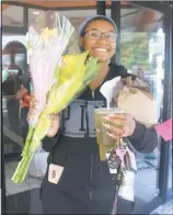  ??  ?? Waldorf resident Mya Westray received two bouquets of flowers at the Panera Bread in Waldorf. “I will give both of these bouquets away to my mom and my older cousin because they are the role models in my life,” she said.