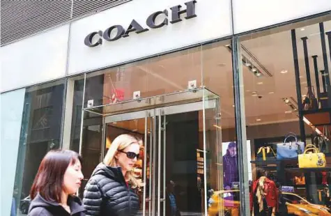  ?? New York Times ?? The Coach store on Madison Avenue in New York. The $2.4 billion acquisitio­n of Kate Spade by Coach is an indication that the American fashion house is aiming to compete with establishe­d European giants like LVMH, Kering and Richmond in the global...