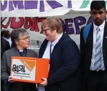  ??  ?? Rev Linda Pollock and Rt Rev Susan Brown, left, with petition; at Govan office, maipicture , with supporters