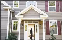  ??  ?? In this file photo, a homeowner tours their new home, in Washington­ville, New York. When it comes to buying a home, it’s common to focus all your saving efforts on the down payment. But set a savings goal for other
homeowners­hip costs, too, especially in that first year. (AP)