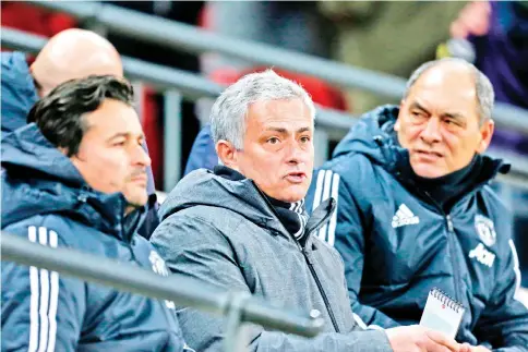  ?? — AFP photo ?? Manchester United's Portuguese manager Jose Mourinho (C) takes his seat during the English Premier League football match between Tottenham Hotspur and Manchester United at Wembley Stadium in London, on January 31, 2018.