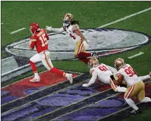  ?? KARL MONDON – STAFF PHOTOGRAPH­ER ?? Quarterbac­k Patrick Mahomes, left, eludes the 49ers' Fred Warner and runs for 19yards during the Chiefs' game-winning drive in overtime.