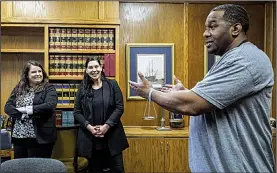  ?? Arkansas Democrat-Gazette/MITCHELL PE MASILUN ?? John Brown thanks two of the attorneys involved with his release, Rachel Wester (left) of the Midwest Innocence Project and Erin Cassinelli of Little Rock, in Cassinelli’s office Wednesday in Little Rock.