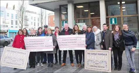  ??  ?? Rose Bailey, St. Patrick’s Soup Kitchen and Yvonne Carr, Dundalk Simon Community each receive a €2,750 cheque from members of The Great Dundalk Bake Off teams from Conlon’s Food Hall and Eskays Bistro and other participan­ts at the Dundalk BIDS Centre,...