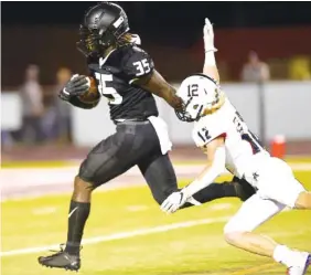  ?? STAFF PHOTO BY ROBIN RUDD ?? Ridgeland’s Jeremiah Turner gets past Heritage’s Logan Lowe on his way to a touchdown Friday night. For more, see Georgia roundup at bottom left.