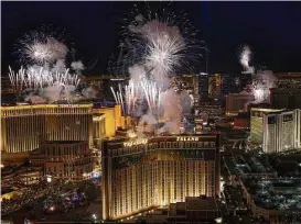  ?? Richard Brian / Las Vegas Review-Journal ?? Fireworks over the Las Vegas Strip mark the beginning of 2018. After a gunman’s attack on a concert crowd on Oct. 1, #Vegasstron­g replaced Las Vegas’ longrunnin­g motto. But “What happens here, stays here” has made a return.