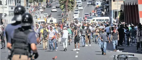  ?? PHOTO: DAVID RITCHIE ?? #FeesMustFa­ll protesters. The author asks whether South Africa is aware of the deep and excruciati­ng consequenc­es of a missed wave of a demographi­c dividend.