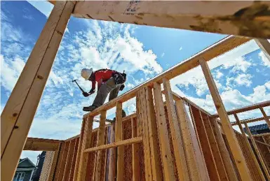  ?? MARCUS OLENIUK/TORONTO STAR FILE PHOTO ?? Although 36,000 families or singles move to the GTA each year, the supply of new lowrise homes is at a record low.