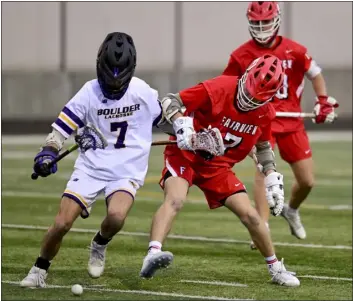  ?? MATTHEW JONAS — STAFF PHOTOGRAPH­ER ?? Fairview’s Quinn Mccall, right, and Boulder’s Jude Scarbrough battle for the loose ball on Thursday night in Boulder.