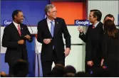  ??  ?? Presidenti­al candidates, from left, Ben Carson, Jeb Bush and Ted Cruz talk after Thursday’s Republican debate.