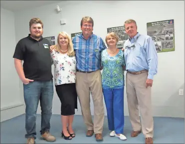  ??  ?? Many family members of Hubert “Hubo” Lee Fisher, who passed away in 1983, attended the opening exhibit of his photo collection at the 6th Cavalry Museum. From left: Hubo’s great grandson Logan Templeton, Karen Templeton, Hubo’s grandson Brent Templeton, Charlotte (Fisher) Templeton, Hubo’s son Doug Fisher. Coca Cola was a big part of soldiers’ lives during World War II, as shown on this panel from an exhibit at the 6th Cavalry Museum.Hubert “Hubo” Lee Fisher (upper left with his camera) was a World War II photograph­er. Images from his collection have been put together into a travelling exhibit by his grandson Brent Templeton and the 6th Cavalry Museum.