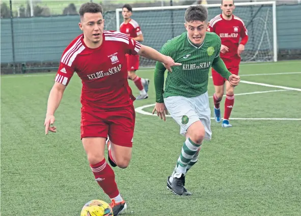  ?? ?? TOUGH GOING: Broughty Athletic, in red, edged a 2-1 victory over a depleted Lochee Harp, who kept the league leaders on their toes.