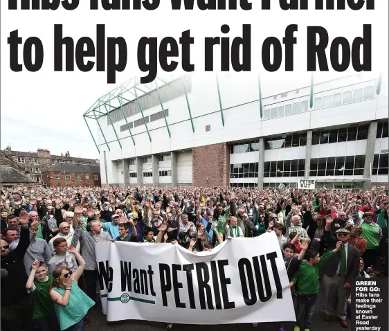  ??  ?? GREEN FOR GO: Hibs fans make their feelings known at Easter Road yesterday