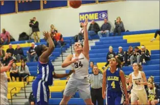  ?? THOMAS NASH - DIGITAL FIRST MEDIA ?? Spring-Ford’s Sarah Cooper (34) sends a shot toward the basket over the defense of William Allen’s Jakayla Wise.