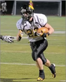  ?? Archived photo by John Gleeson ?? Archbishop Wood’s Josh Messina registered the first points for the Vikings when he reached the end zone on a 55-yard touchdown run.