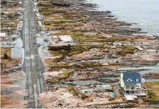  ?? Houston Chronicle file ?? A single house is left standing amid the devastatio­n in Gilchrist left by Hurricane Ike. The storm killed 74 people in the U.S.