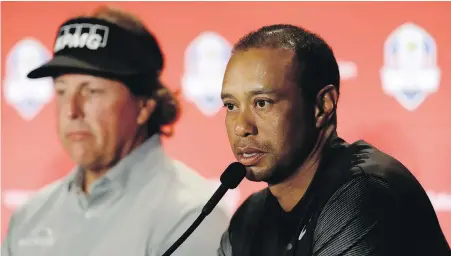  ?? MATT SLOCUM, THE ASSOCIATED PRESS ?? Tiger Woods, right, and Phil Mickelson were named as captain’s picks to the 2018 U.S. Ryder Cup Team on Tuesday, with Woods saying it’s “beyond special” to be back on the team.