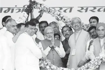  ??  ?? Modi greets his party supporters during an election campaign rally in Meerut in the northern Indian state of Uttar Pradesh, India. — Reuters photo