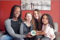  ?? NEWS PHOTO MO CRANKER ?? Daniel’s Dip owners Daniel Kapeta and Amy Kopp show off a tub of their now-famous dip with their kids Alana Willis and Aliya Kapeta. The dip is locally made and sold around the city.