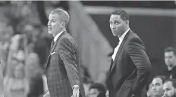  ??  ?? Former Southern California men’s assistant basketball coach Tony Bland, right, was fired by the school in January 2018 and later pleaded guilty to conspiracy to commit bribery. USC’s Andy Enfield, also pictured, remains as head coach.