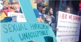  ??  ?? Former employees and supporters protest Wednesday outside a Burger King restaurant in the Loop.
| ANDREA SALCEDO/ SUN- TIMES