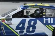  ?? LARRY PAPKE — THE ASSOCIATED PRESS ?? Jimmie Johnson gestures by the start/finish line as he celebrates his win in the NASCAR Cup Series auto race at Texas Motor Speedway in Fort Worth, Texas, Sunday.