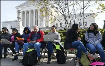  ?? ASSOCIATED PRESS ?? People wait in line outside the Supreme Court in Washington Monday, Nov. 11, 2019, to be able to attend oral arguments in the case of President Donald Trump’s decision to end the Obama-era, Deferred Action for Childhood Arrivals program (DACA).