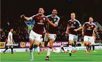  ?? Reuters ?? Burnley’s Michael Keane (left) celebrates scoring their second goal with George Boyd and teammates against Watford in Turf Moor.