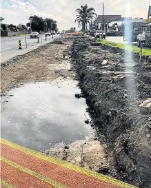  ?? Picture: SUPPLIED SUPPLIED ?? IN LIMBO: The section of road to be widened once work commences on Gonubie Main Road. Sewage water is seen flowing out from the cracked manhole.