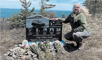  ?? LORI PHILLIPS THE CANADIAN PRESS ?? Lori Phillips crouches by the monument rememberin­g her son, Aaron Cogswell, and the others aboard the Chief William Saulis when it went down in 2020.