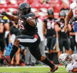  ?? John E. Moore III / Getty Images ?? After barely escaping FCS school Houston Baptist in their opener, DL Jaylon Hutchings and Texas Tech know they’ll have to do better against the Longhorns.