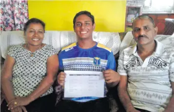  ?? Photo: Kathrin Krishna Kumar. ?? Rishav (middle) with his mum Sunita Prasad and dad Dhirendra Prasad in Lautoka yesterday.