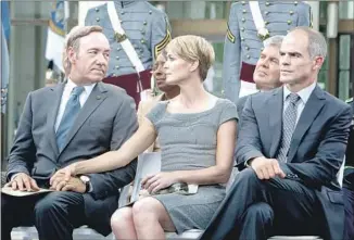  ?? Patrick Harbron Netf lix ?? FRANK UNDERWOOD (KEVIN SPACEY), left, Claire Underwood (Wright) and Doug Stamper (Michael Kelly) in a previous season of “House of Cards.” Spacey has been dropped from the show.