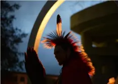  ?? Astrid Riecken/For The Washington Post ?? Native American veterans, including Hamilton Tongkeamha, 37, from the Kiowa tribe in Oklahoma, gather at the National Native American Veterans Memorial on Nov. 11.