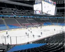  ??  ?? The Avalanche play the St. Louis Blues in the first period at an empty Ball Arena on Wednesday night.