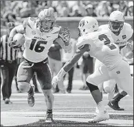  ?? AP/L.G. PATTERSON ?? Running back Damarea Crockett (Little Rock Christian) ran for 202 yards and 2 touchdowns on 18 carries Saturday to lead the Missouri Tigers to a 72-43 victory over the Missouri State Bears in Columbia, Mo.