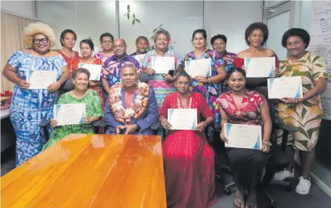  ?? Photo: AZARIA FAREEN ?? The newly-graduated women entreprene­urs are all smiles as they pose with their certificat­es with the ministry’s acting Director and Registrar of Co-operatives, Iosefo Koroidimur­i.