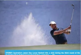  ?? — AP ?? SYDNEY: Australia’s Jason Day Lucas Herbert hits a shot during the third round of the Australian Open Golf tournament in Sydney, yesterday.