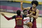  ?? TONY DEJAK — THE ASSOCIATED PRESS ?? The Rockets’ Victor Oladipo drives to the basket between Jarrett Allen and Darius Garland on Feb. 24at Rocket Mortage FieldHouse.